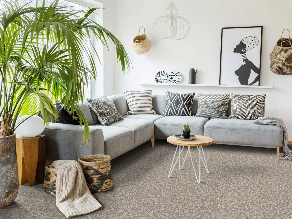 Brown carpet with grey corner sofa