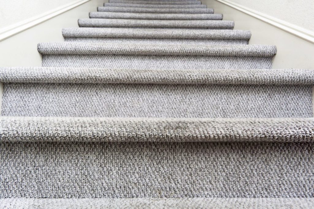 Grey wool stair runner fitted on a staircase in a Tunbridge Wells home